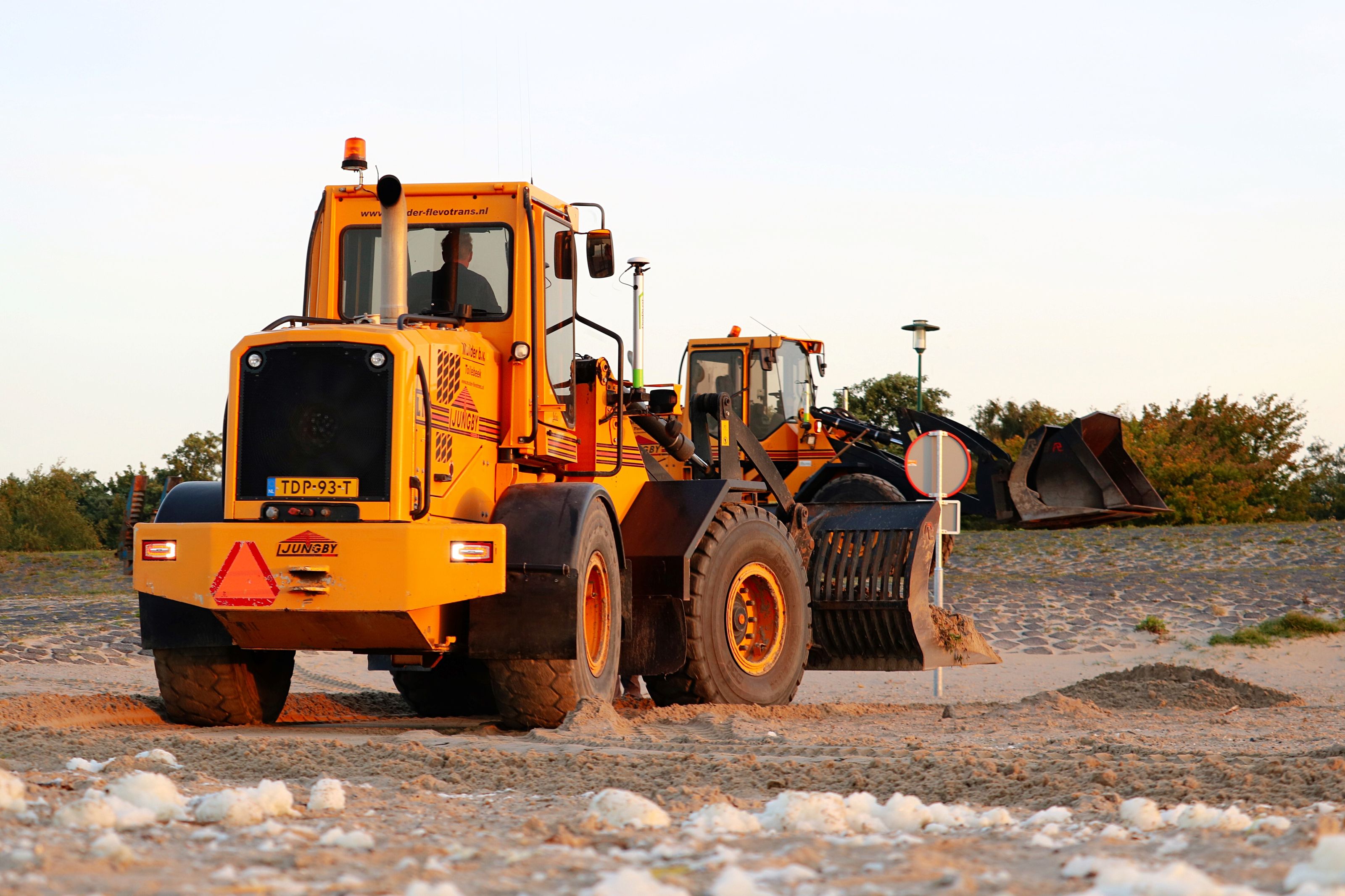 Motor grader levelling a haul road
